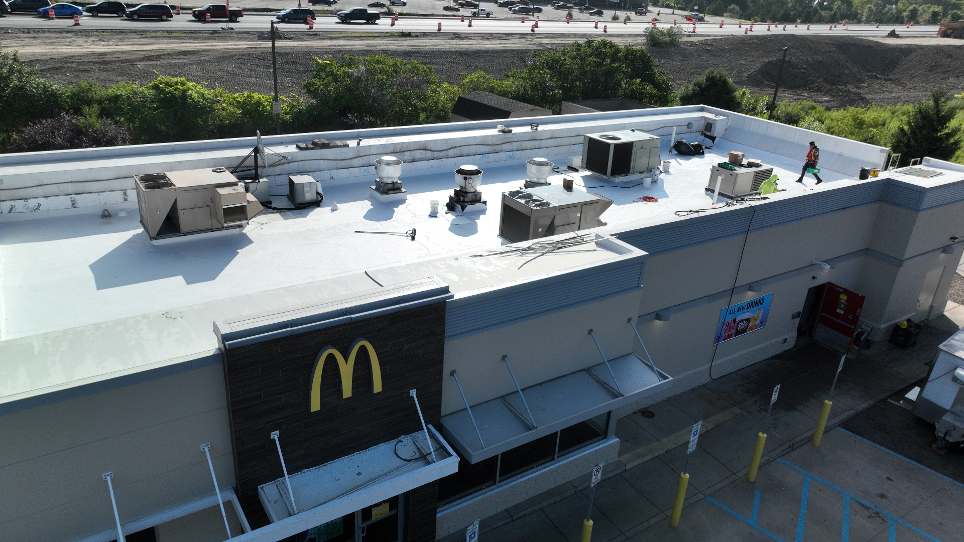 Completed white commercial flat roof photographed from a drone